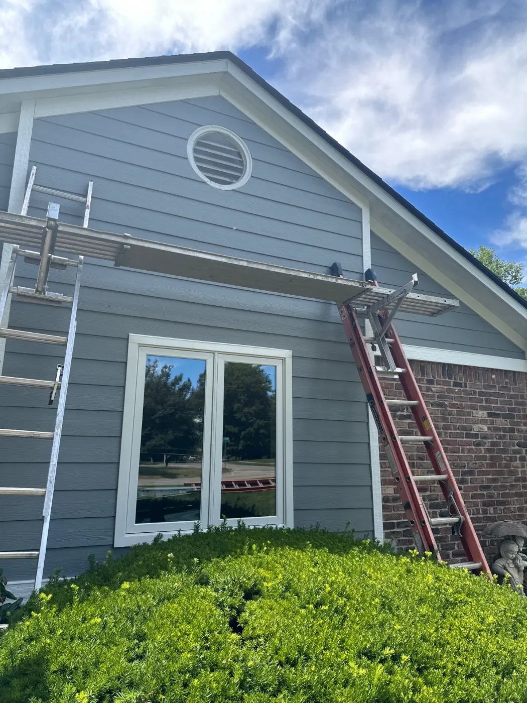 Siding installation documented in Clay Corner